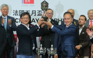 Controversial political figure Junius Ho (second from left) receives a trophy after his horse Hong Kong Bet won a race at Happy Valley in May. Photos: Kenneth Chan