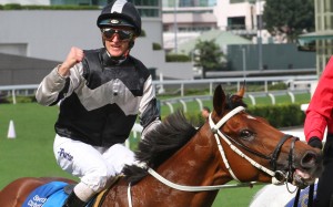 Zac Purton celebrates after piloting Exultant to Group One glory last season. Photos: Kenneth Chan