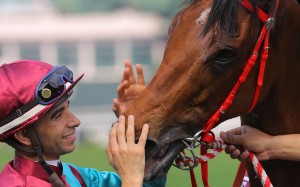 Joao Moreira gives Beat The Clock a pat after their win in the Chairman’s Sprint Prize. Photos: Kenneth Chan