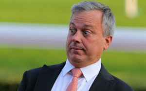 Trainer Caspar Fownes plays up for the cameras after winning with Enfolding at Sha Tin on Sunday. Photo: Kenneth Chan