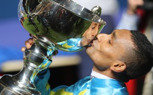 Karis Teetan kisses the Longines International Jockeys’ Championship trophy at Happy Valley on Wednesday night. Photo: Kenneth Chan