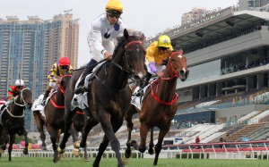 Golden Sixty surges home to win ahead of stablemate More Than This at Sha Tin on Monday. Photos: Kenneth Chan