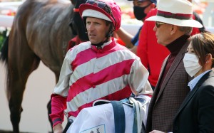 Hugh Bowman and John Moore talk after the run of Enjoying in the Classic Cup. Photos: Kenneth Chan