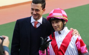 Trainer Douglas Whyte with jockey Alexis Badel at Sha Tin after a win from Super Wealthy.
