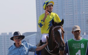 John Moore returns with jockey Hugh Bowman after winning the Champions & Chater Cup with Werther in 2017.