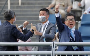 Golden Sixty’s owner Stanley Chan (right) celebrates his win in the BMW Hong Kong Derby. Photos: Kenneth Chan