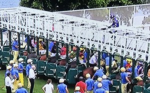 Jockey Antoine Hamelin sits above the barrier stalls as attendants attempt to remove Fast Pace from the barriers. Photo: SCMP