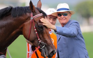 John Moore gives Beauty Generation a pat after his win in the 2019 Champions Mile. Photos: Kenneth Chan
