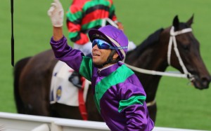 Joao Moreira celebrates his opening-day win aboard Excellent Proposal with his customary whip throw. Photos: Kenneth Chan