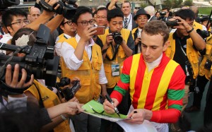 Ryan Moore surrounded by press after winning the 2016 Hong Kong Cup aboard Maurice. Photos: Kenneth Chan
