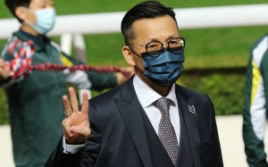 Frankie Lor celebrates his treble at Sha Tin yesterday. Photos: Kenneth Chan