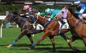 Keith Yeung drives The Anomaly (left) to victory at Happy Valley on Wednesday night. Photo: Kenneth Chan