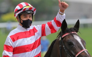Derek Leung celebrates his victory aboard Love Me More at Sha Tin on Sunday. Photos: Kenneth Chan
