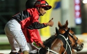 Karis Teetan celebrates after saluting aboard Party Everyday. Photos: Kenneth Chan