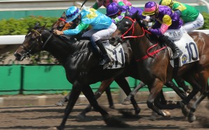 Joao Moreira boots Steel Win (blue silks) home at Sha Tin on Sunday. Photos: Kenneth Chan