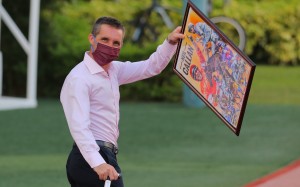 Jockey Neil Callan walks out of the races having being presented with a collage of his winners by members of the local press. Photos: Kenneth Chan