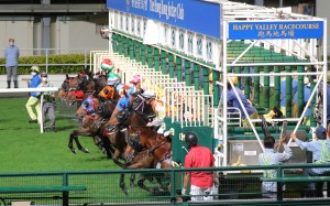 Horses jumps out of the gates at Happy Valley. Photos: Kenneth Chan