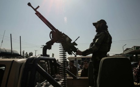 A Taliban security guard rides an armed vehicle on the outskirts of Jalalabad, Afghanistan, on February 28. Photo: AFP
