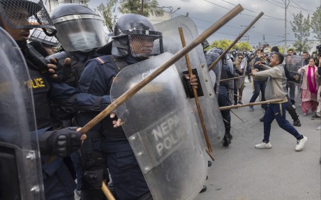 Police clash with activists during a protest against the arrest of former prime minister K.P. Sharma Oli in Kathmandu, Nepal, on March 29. Photo: EPA