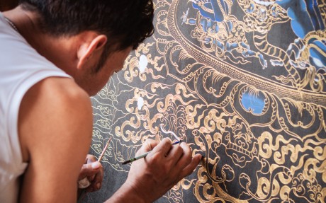 Kinley Tshering paints a thangka of Vajrakilaya, a wrathful deity of Vajrayana Buddhism, Bhutan’s state religion, at the Exotic Art Gallery, in Punakha district, Bhutan. Photo: Jen Paolini