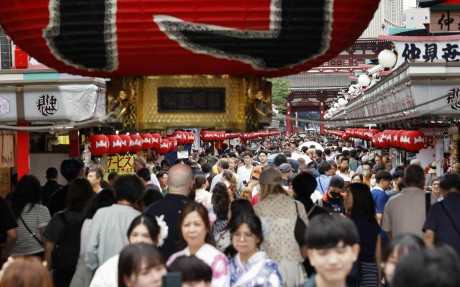 Tourists throng a shopping street in front of Sensoji Temple in the popular Asakusa district of Tokyo, Japan, last month. Photo: Kyodo