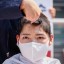 A South Korean university student gets her head shaved during a protest against Japan's decision to release contaminated water from its crippled Fukushima nuclear plant into the sea, in front of the Japanese embassy, in Seoul, South Korea, on April 20. Photo: Reuters