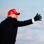 US President Donald Trump tosses a 'Make America Great Again' (MAGA) cap during a campaign rally in Aoca, Pennsylvania on November 2. Photo: Reuters