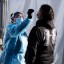 A health worker administers a test at a Covid-19 testing tent outside a Bay Area Rapid Transit station in the Mission district of San Francisco, California. Photo: Bloomberg