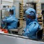 Work in progress at the US Army Medical Research Institute of Infectious Diseases at Fort Detrick, Maryland, in 2002. Research at the facility, equipped to handle dangerous pathogens such as Ebola and plague, was suspended in 2019 over safety concerns. Photo: AFP
