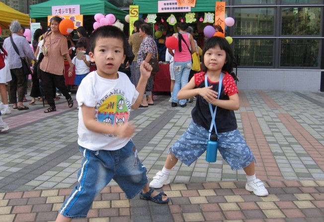 Chan (right) when she was three years old with her cousin.
