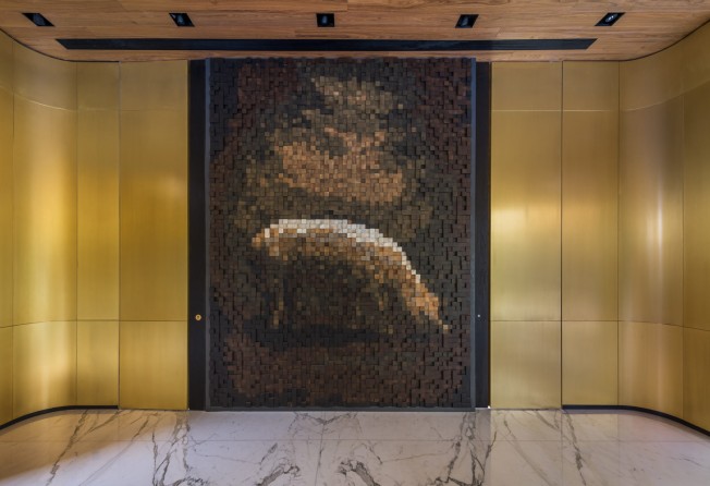 The pig mosaic is made up of nearly 4,500 timber blocks. Photo: Ta.Le Architects