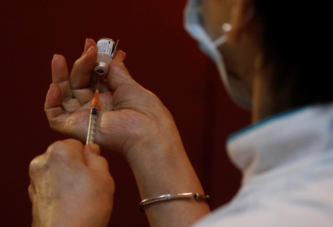 A nurse prepares a coronavirus vaccination in Singapore. Photo: Reuters