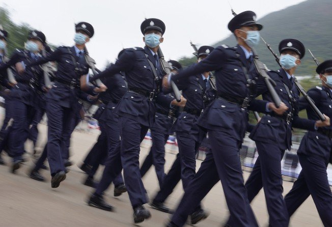 Police officers participate at a passing-out parade at the Hong Kong Police College in Wong Chuk Hang. Photo: Winson Wong
