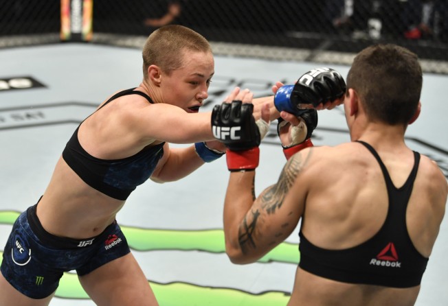 Rose Namajunas punches Jessica Andrade in their strawweight fight at UFC 251. Photo: Jeff Bottari/Zuffa LLC