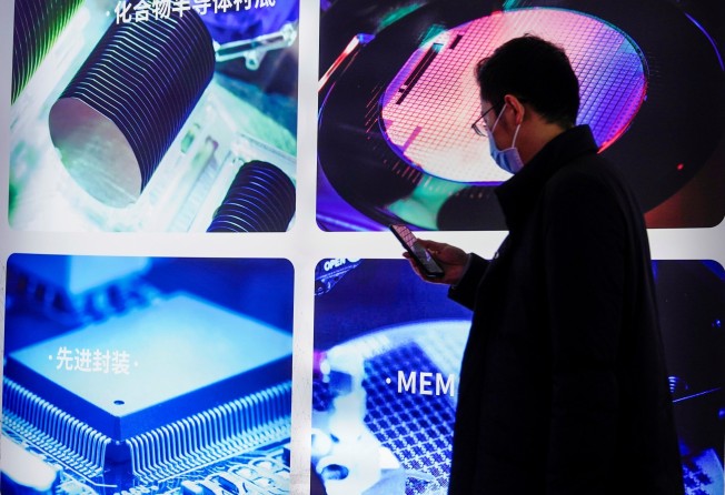 A man visits a display of semiconductor devices at Semicon China, a trade fair for integrated circuit technology, in Shanghai on March 17, 2021. Photo: Reuters