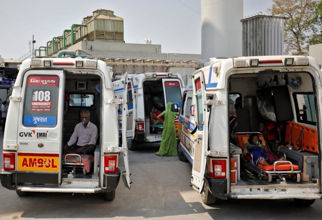 Patients wearing oxygen masks wait inside ambulances as they queue to enter a Covid-19 hospital in Ahmedabad on Wednesday. Photo: Reuters