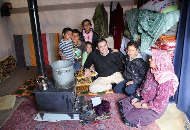Begbie with Syrian refugees in Lebanon in 2014. Photo: Courtesy of David Begbie