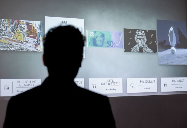 A visitor looks at an ‘NFT digital artwork’ auctioned on May 20 at the Millon Belgique auction house, in Brussels on May 18, 2021. Photo: AFP