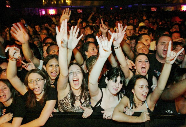 Fans react at a Papa Roach concert. Celebrity crushes are usually associated with screaming teenage girls at film premieres or concerts, but adults have them too. Photo: Getty Images
