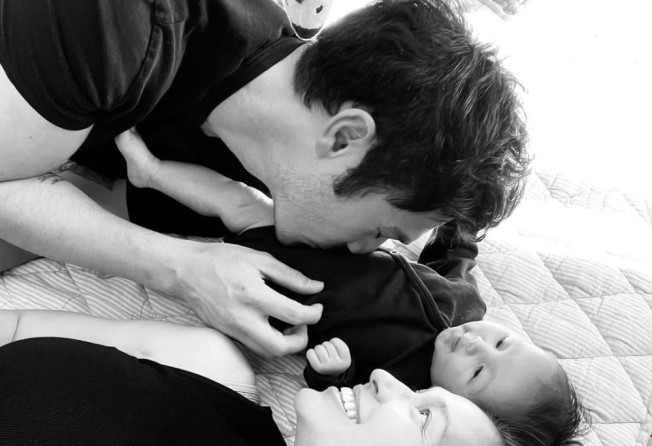 Henry Golding, his wife, and his daughter. Photo: @livlogolding/Instagram