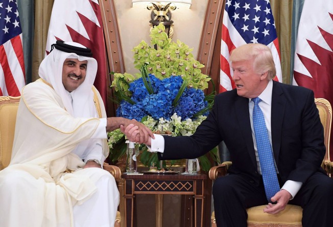 Former US President Donald Trump shakes hands with Qatar’s Sheikh Tamim bin Hamad al-Thani in the Saudi capital Riyadh. Photo: AFP 