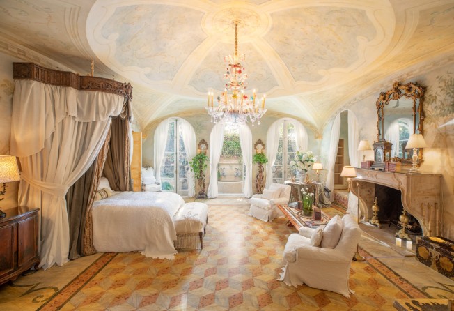 The master bedroom features a vaulted ceiling decorated with frescoes. Photo: Anthony Barcelo