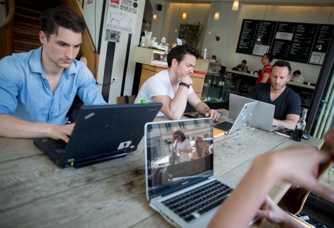 Customers work on their laptops at the St Oberholz cafe in Mitte, Berlin. Photo: Getty Images