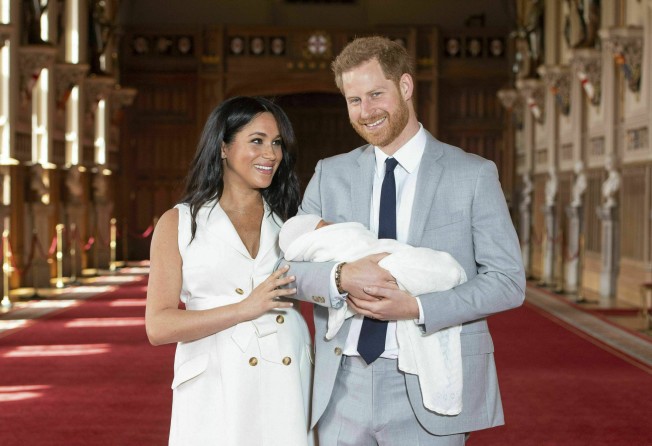 Britain’s Prince Harry and Meghan, Duchess of Sussex, pose during a photocall with their newborn son Archie, in St. George’s Hall at Windsor Castle, Windsor, south England, in May 2019. Photo: AP