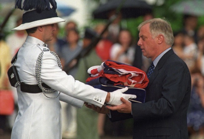 Chris Patten, the last governor of Hong Kong, receiving the Union flag flag during a farewell ceremony at Government House on June 30,1997. Photo: AFP