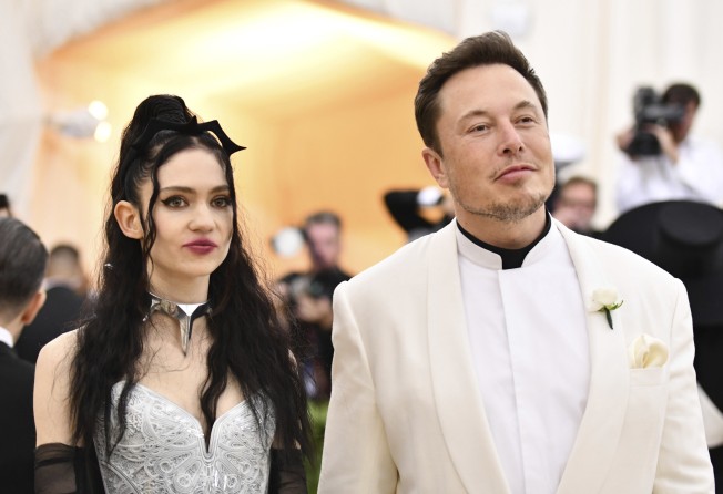 Grimes and Elon Musk attend The Metropolitan Museum of Art’s Costume Institute benefit gala celebrating the opening of the “Heavenly Bodies: Fashion and the Catholic Imagination” exhibition in May 2018, in New York. Photo: Invision/AP