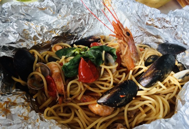 Linguine with seafood wrapped in foil. Photo: Silvia Marchetti