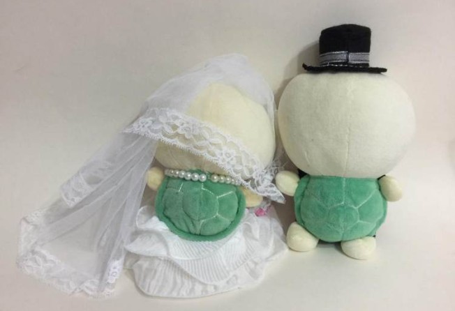 Couples sometimes present Law with dolls not in human form. In this case, they requested that their turtle plush dolls’ shells be kept visible on their backs. Photo: Irene Law Oi-ling