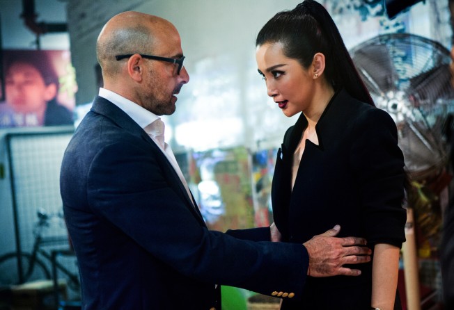 Stanley Tucci and Li Bingbing in a still from Transformers: Age of Extinction.