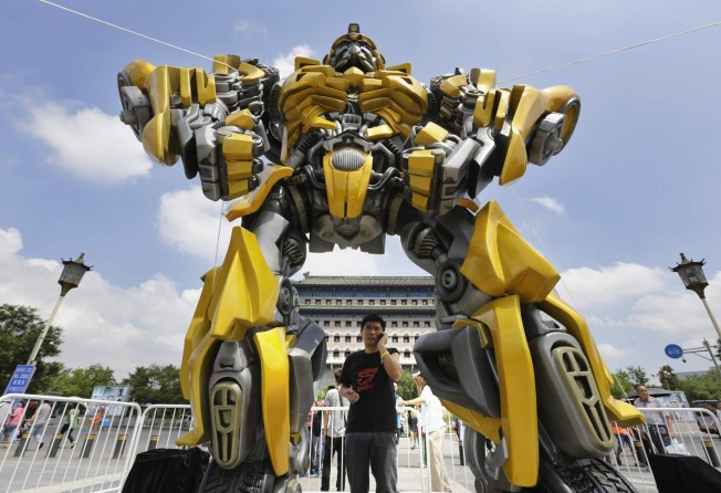 A model of the Transformers character Bumblebee in front of Qianmen Gate in central Beijing in 2014. Photo: Jason Lee/Reuters